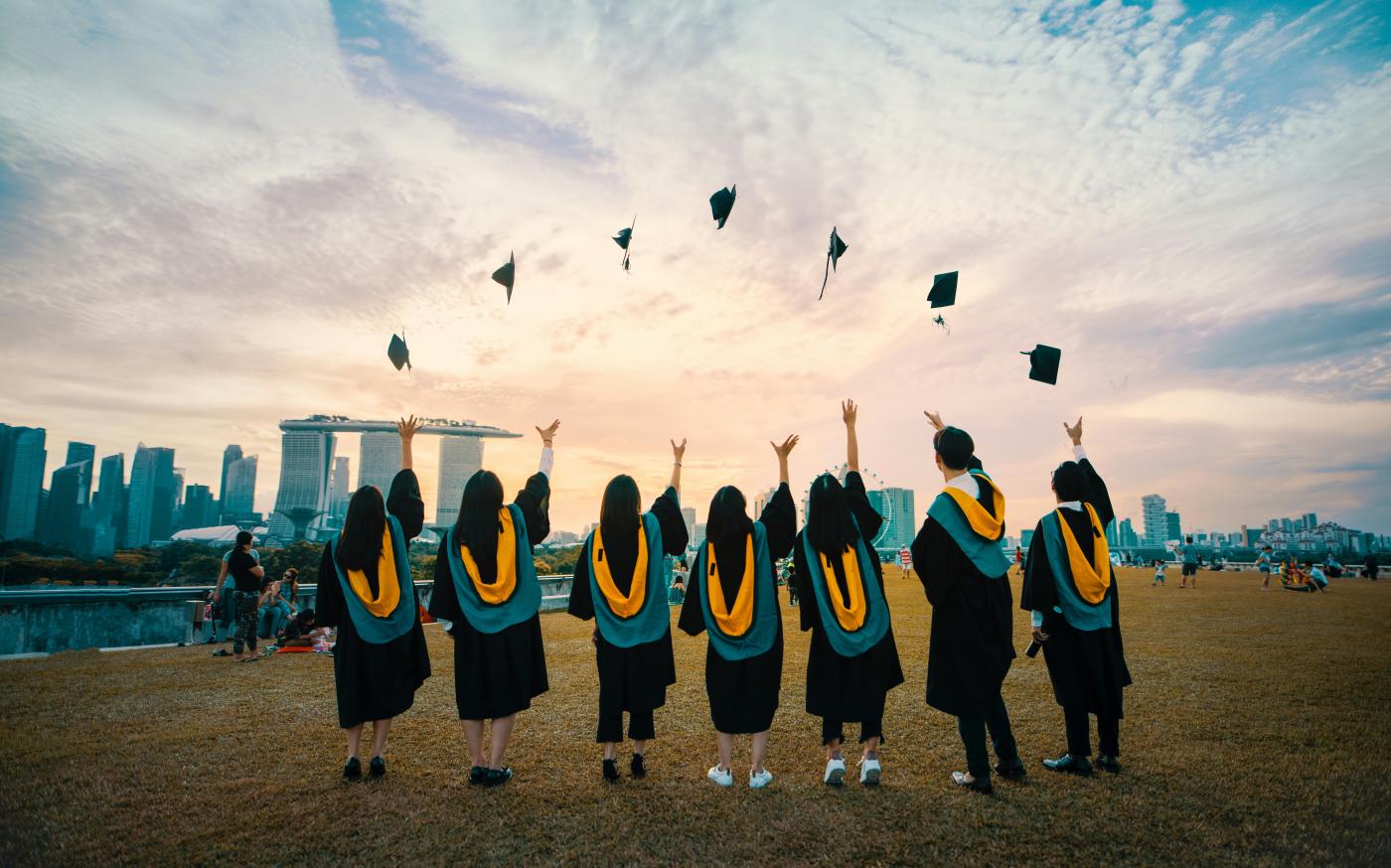 people throwing hats on air by Pang Yuhao courtesy of Unsplash.