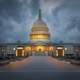 The u s capitol building lit up at night by Pierre Blaché courtesy of Unsplash.